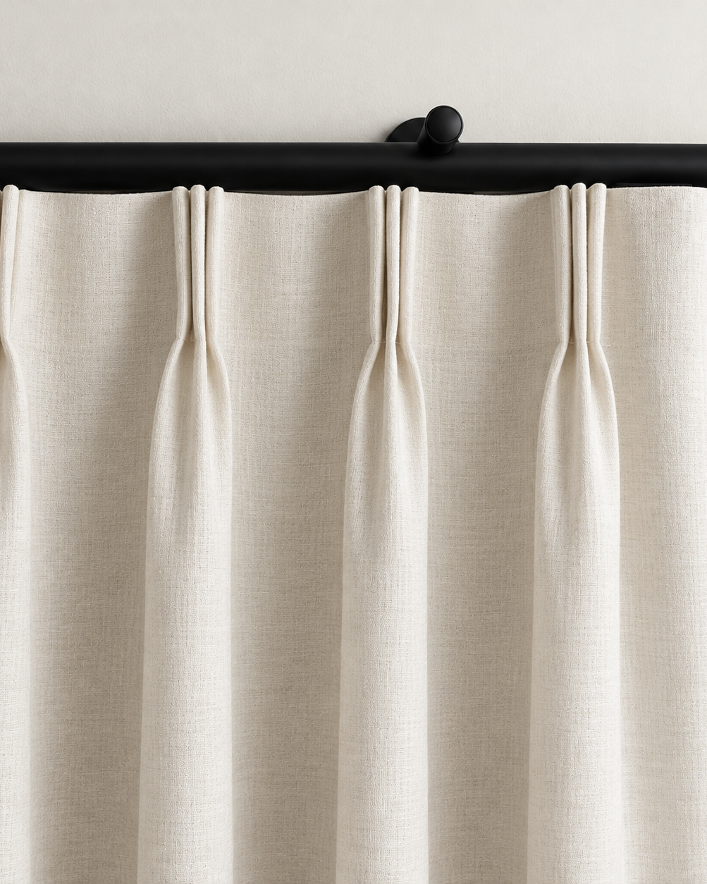 Rylan black motorized curtain rod with ivory pinch pleat curtains