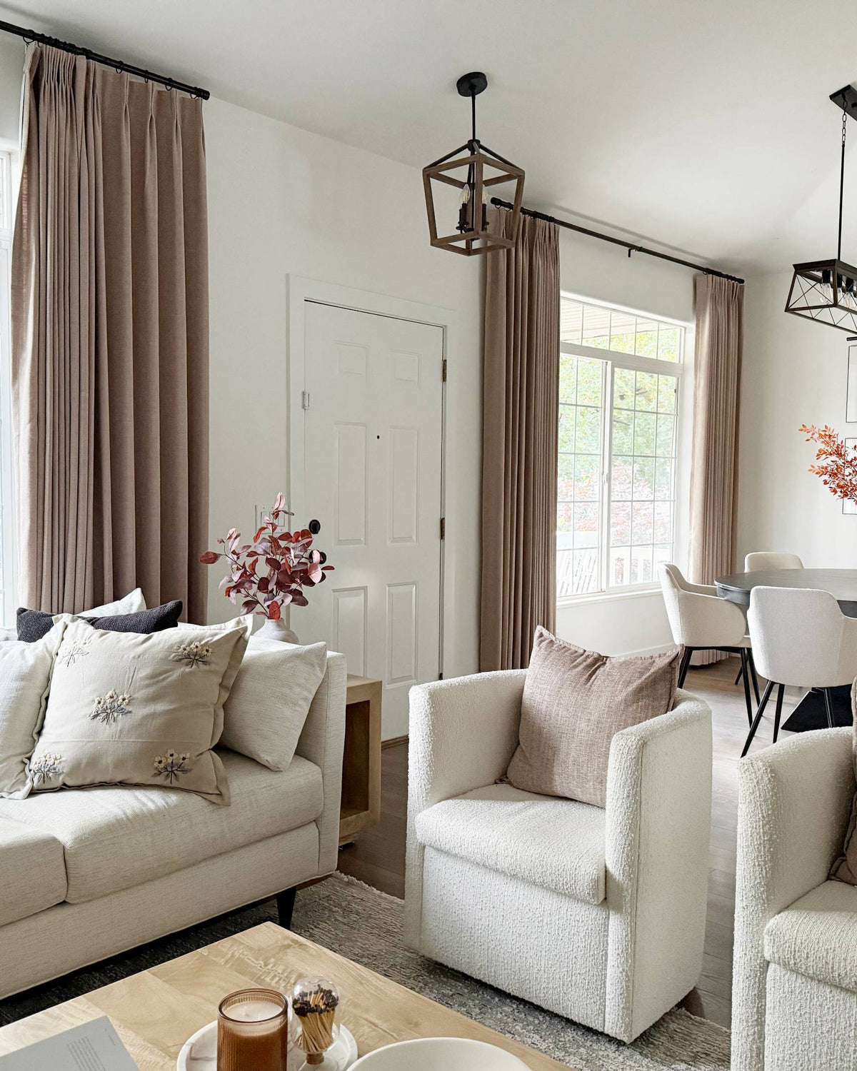Lena Linen Soft Pebble-L2311 pleated drapery in a bright living and dining room