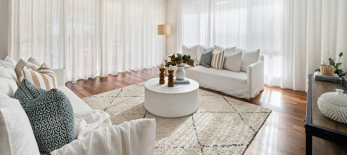 Elegant pinch pleated curtains adding sophistication to a cozy living room