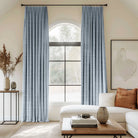 blue curtains blending linen, cotton, and polyester with black curtain rods, perfect for the living room