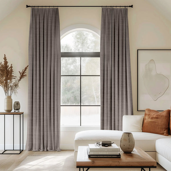 Dark grey curtains blending linen, cotton, and polyester with black curtain rods, perfect for the living room.