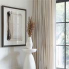 White cotton grommet curtains, perfect for adding a cozy and elegant touch to the bedroom.