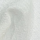 Close-up of sheer fabric sample with a textured weave, perfect for light, airy curtain designs or upholstery.