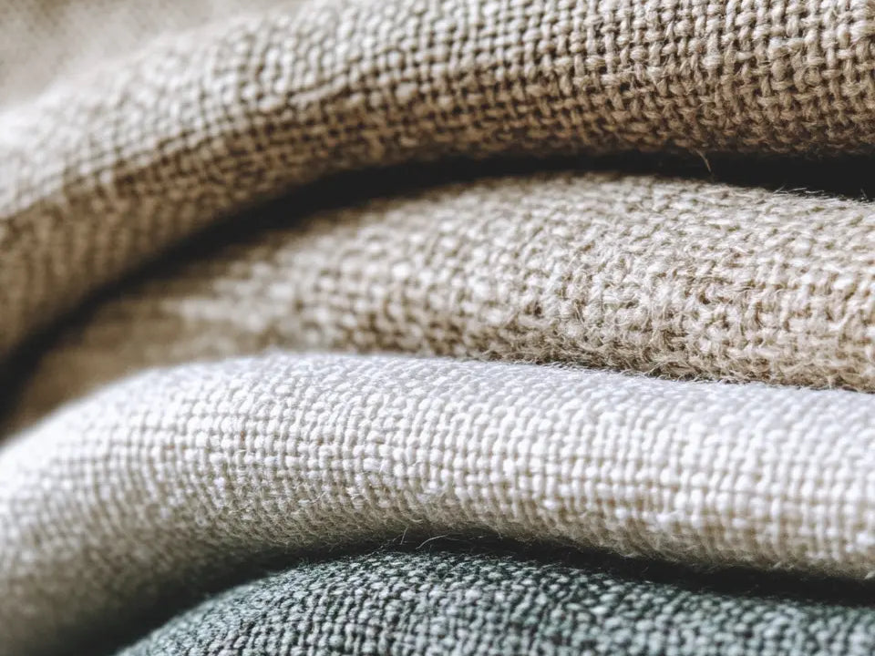 Close-up of beige and neutral fabric textures, ideal for curtain materials.