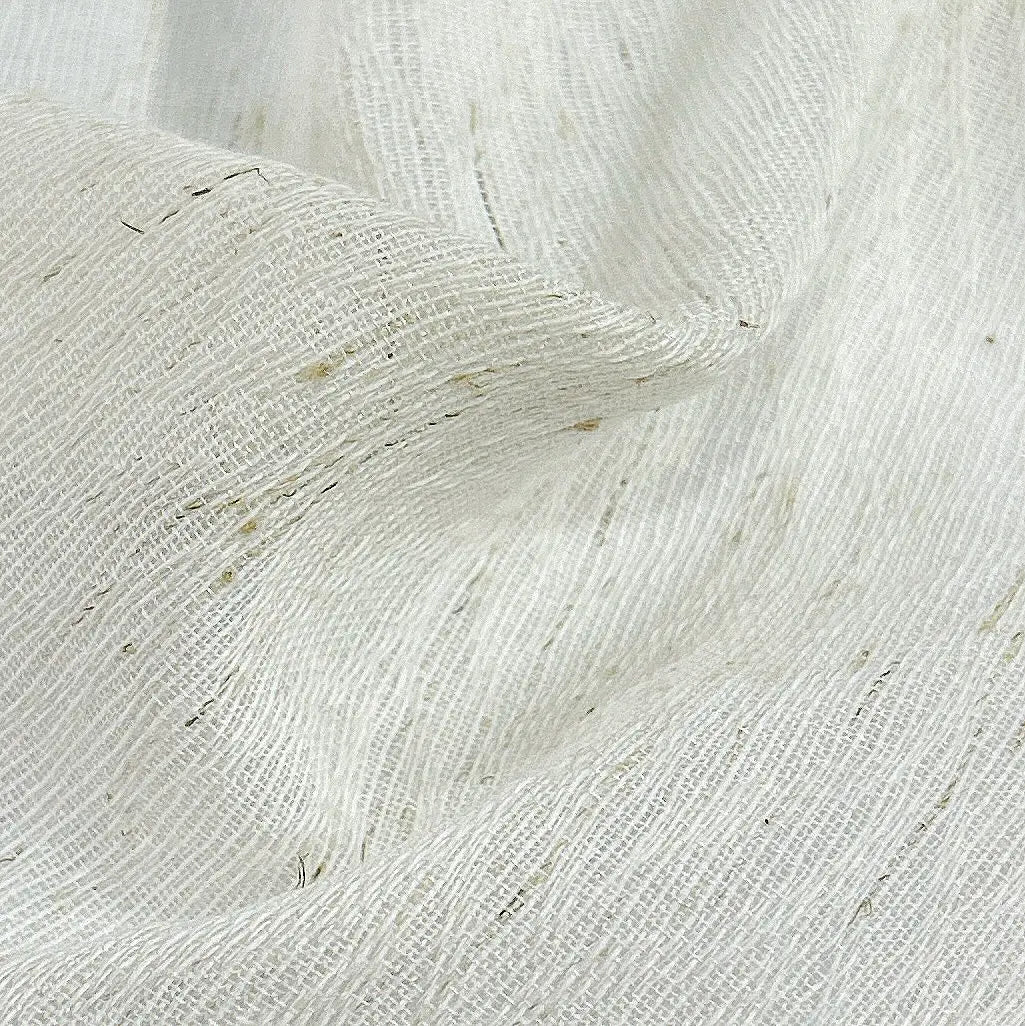 Close-up of sheer fabric sample with a textured weave, perfect for light, airy curtain designs or upholstery.