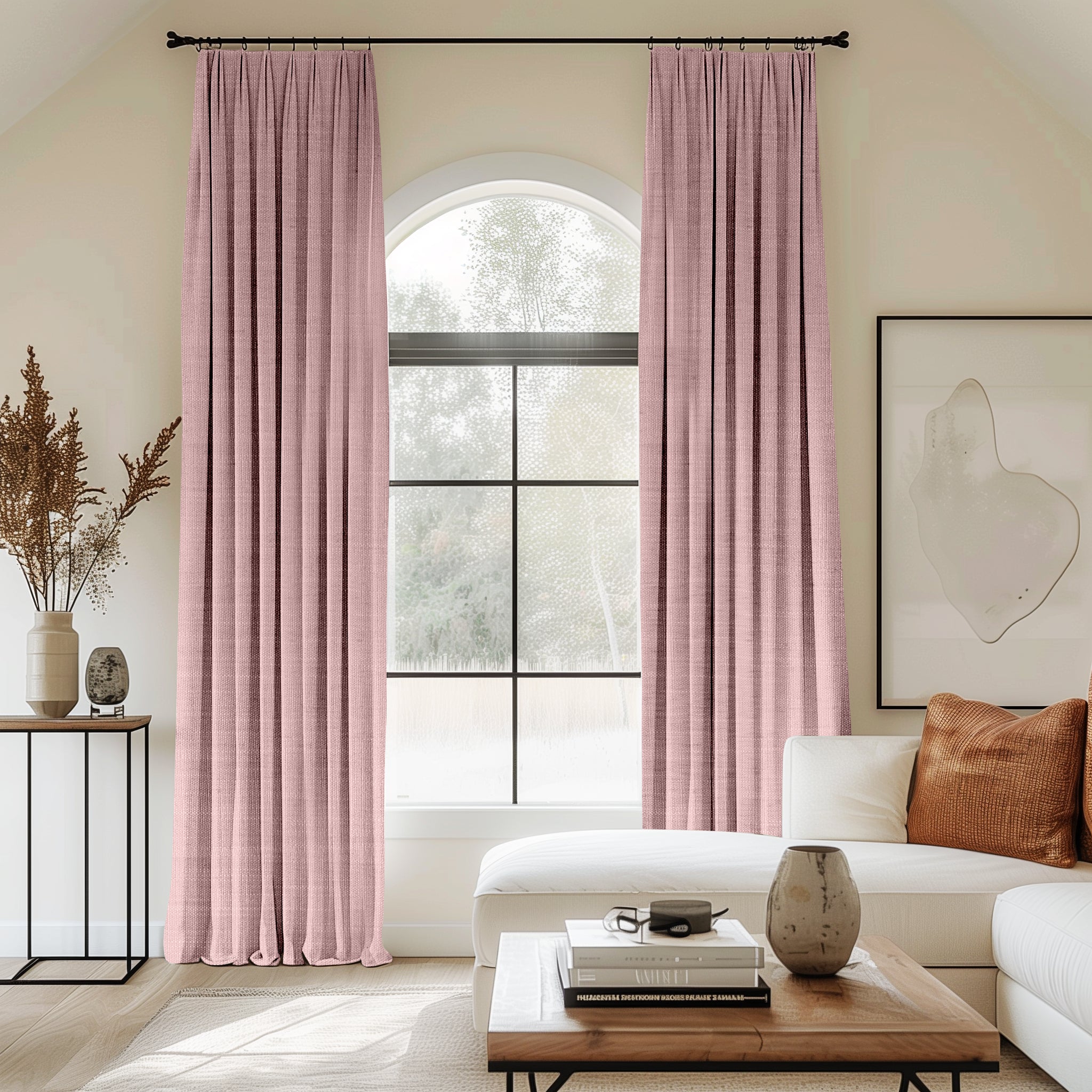 Living room with arched window featuring pink velvet pleated curtains.