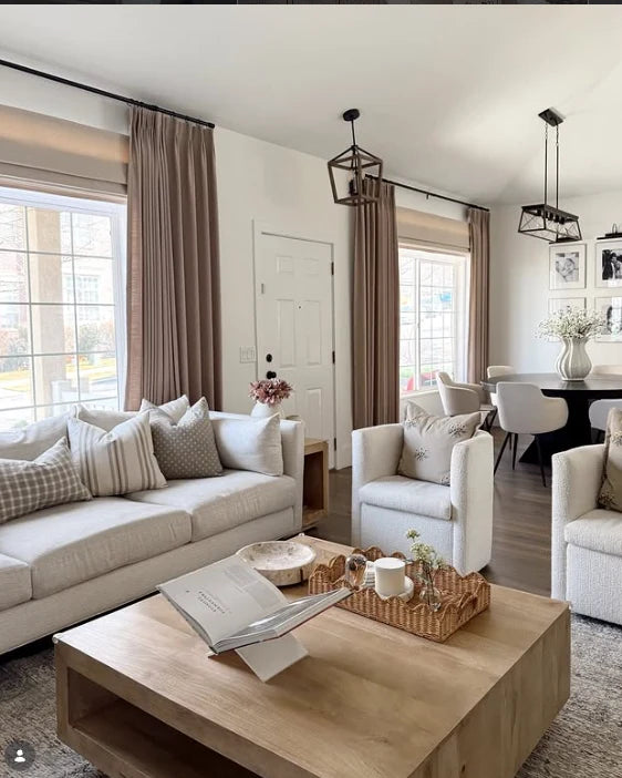 Kelsie's living room with Roman shades and drapery