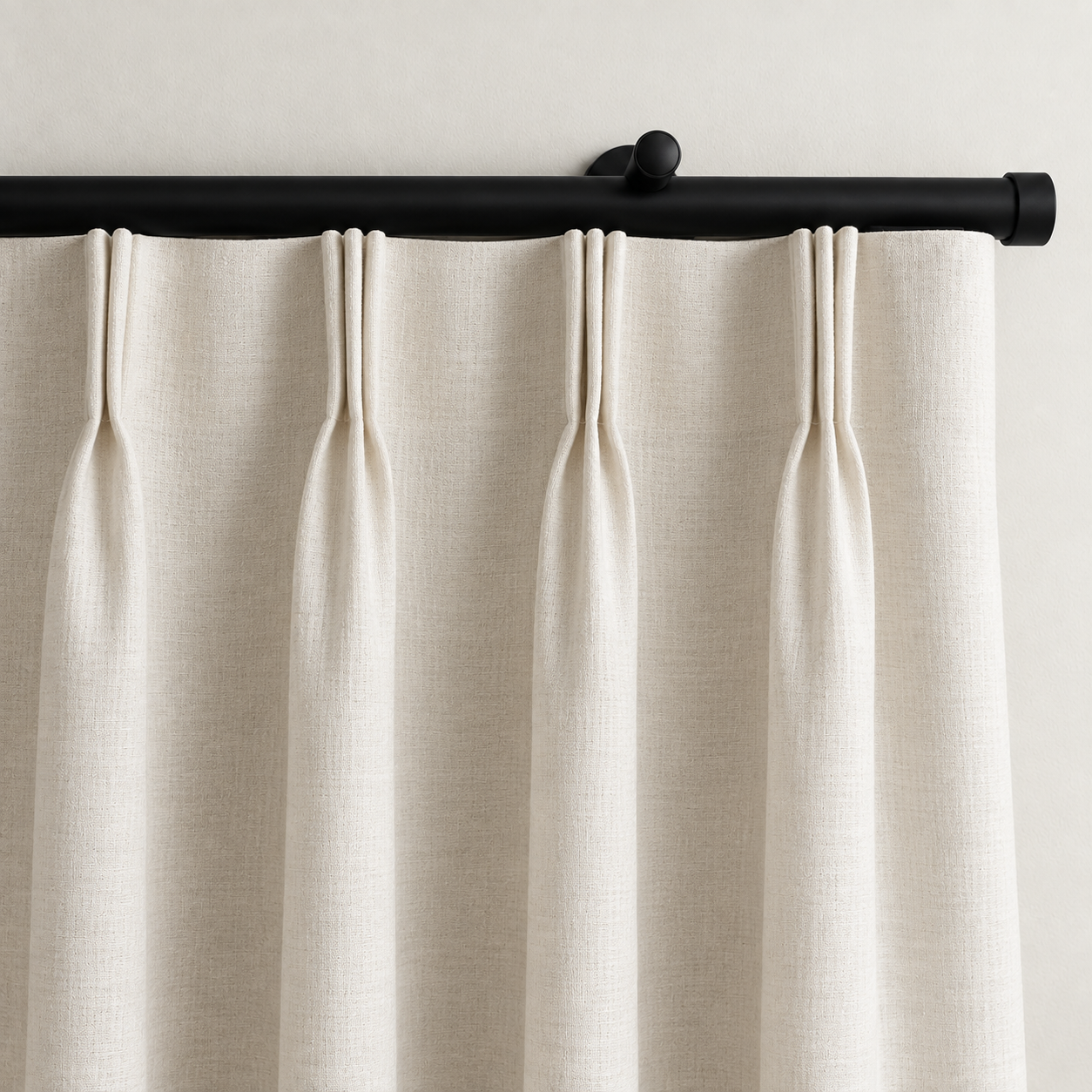 Rylan black motorized curtain rod with ivory pinch pleat curtains